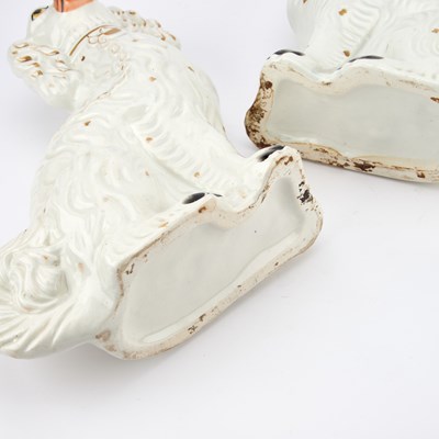 Lot 35 - A PAIR OF VICTORIAN STAFFORDSHIRE POTTERY MODELS OF SEATED SPANIELS