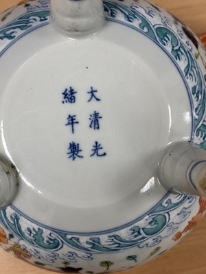 Lot 113 - A CHINESE PORCELAIN DOUCAI DECORATED TWO-HANDLED TRIPOD CENSER