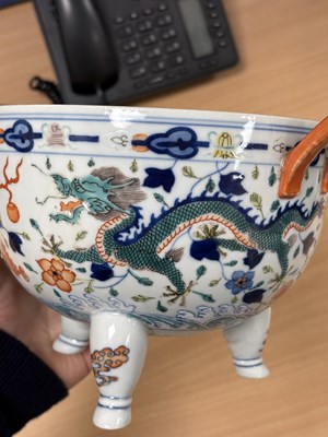 Lot 113 - A CHINESE PORCELAIN DOUCAI DECORATED TWO-HANDLED TRIPOD CENSER