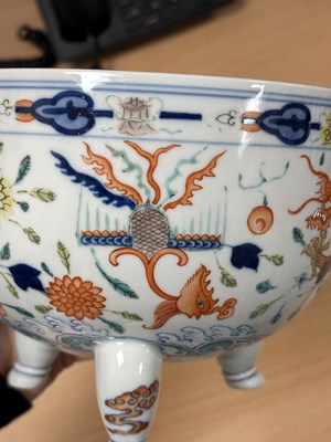 Lot 113 - A CHINESE PORCELAIN DOUCAI DECORATED TWO-HANDLED TRIPOD CENSER