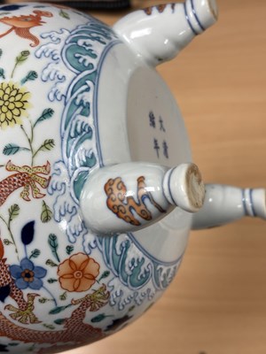 Lot 113 - A CHINESE PORCELAIN DOUCAI DECORATED TWO-HANDLED TRIPOD CENSER