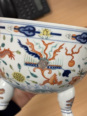 Lot 113 - A CHINESE PORCELAIN DOUCAI DECORATED TWO-HANDLED TRIPOD CENSER