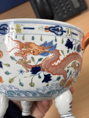 Lot 113 - A CHINESE PORCELAIN DOUCAI DECORATED TWO-HANDLED TRIPOD CENSER