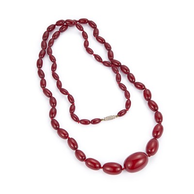 Lot 717 - A CHERRY AMBER BAKELITE BEAD NECKLACE