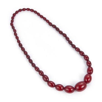 Lot 724 - A CHERRY AMBER BAKELITE BEAD NECKLACE