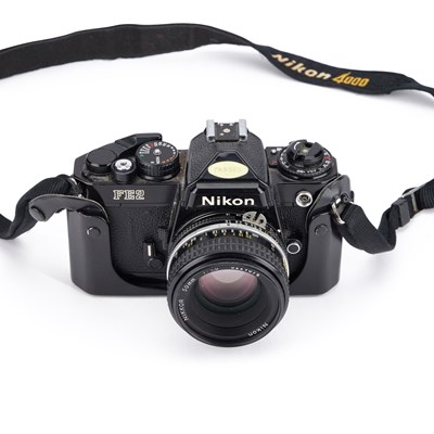 Lot 744 - A NIKON FE2 SLR CAMERA