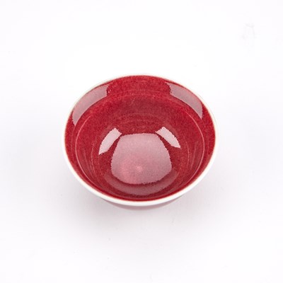 Lot 105 - A SMALL CHINESE OX-BLOOD PORCELAIN BOWL