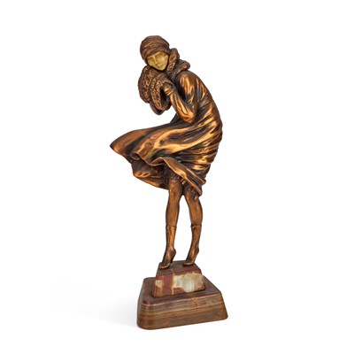 Lot 242 - AN ART DECO STYLE PATINATED METAL AND FAUX IVORY FIGURE