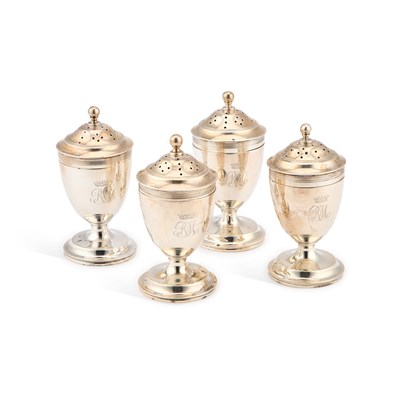 Lot 665 - A SET OF FOUR GEORGE V SILVER PEPPER POTS