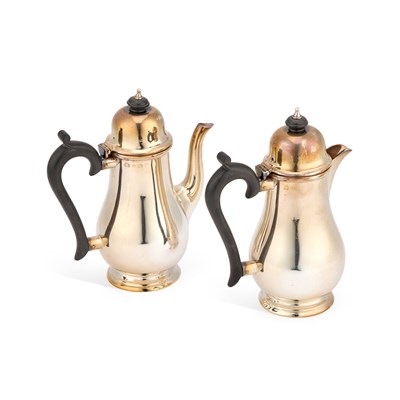 Lot 672 - A PAIR OF EDWARD VIII SILVER CAFE AU LAIT POTS