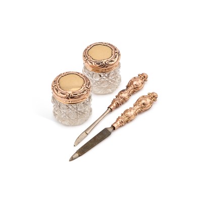 Lot 284 - A PAIR OF 9 CARAT GOLD AND CUT-GLASS DRESSING TABLE JARS
