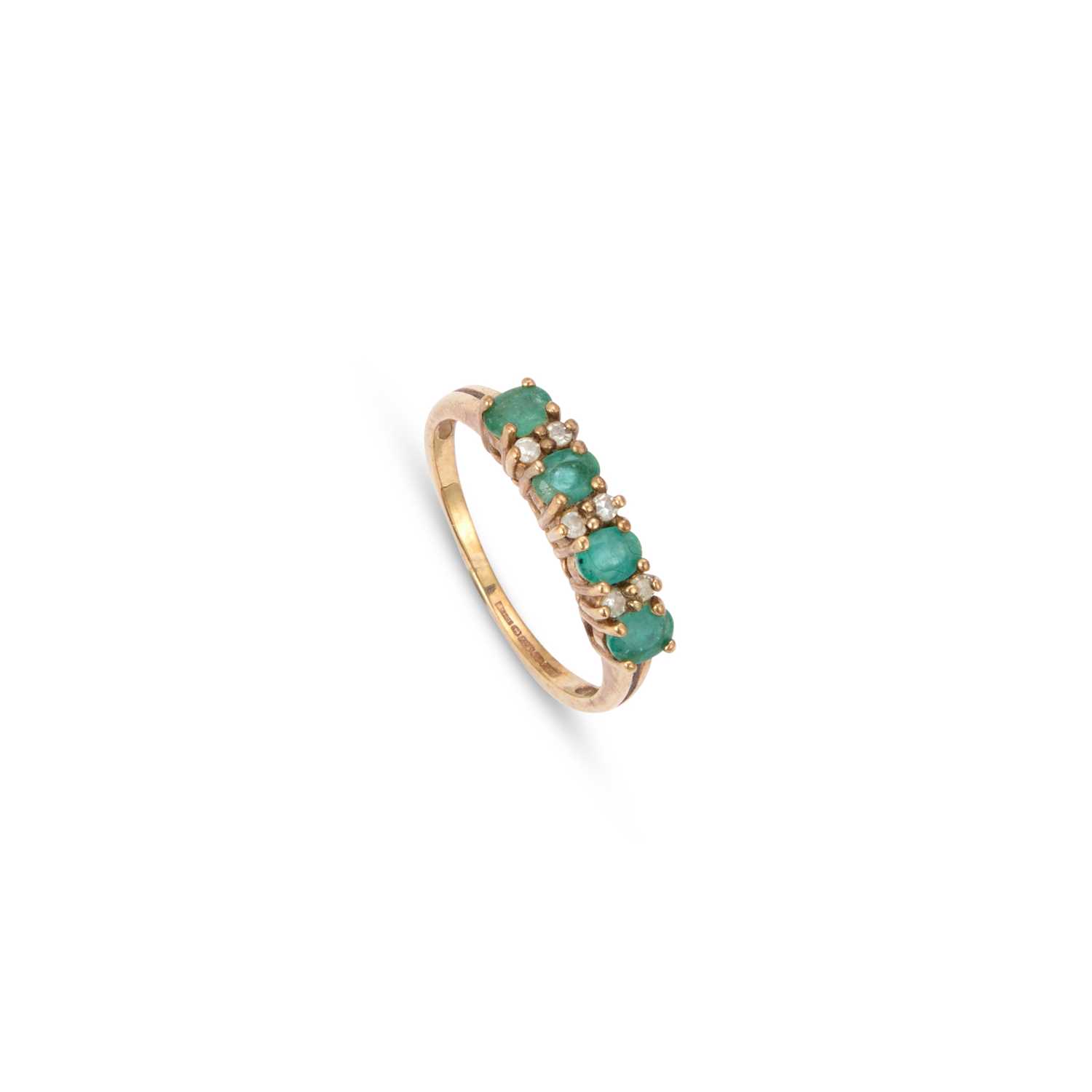 Lot 928 - A 9 CARAT GOLD HALF HOOP EMERALD AND DIAMOND RING