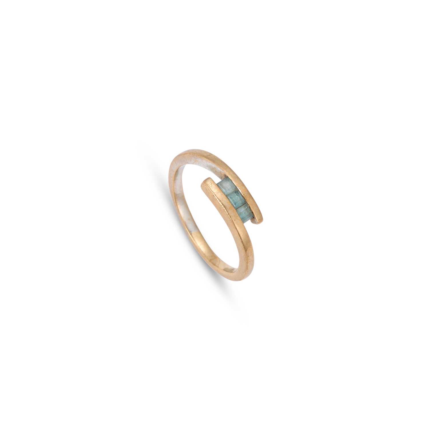 Lot 953 - A 9 CARAT GOLD THREE STONE BLUE TOPAZ RING