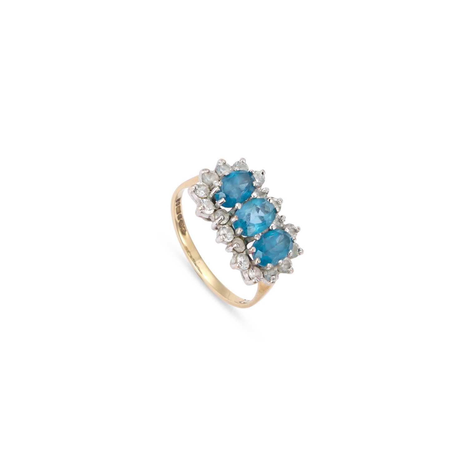 Lot 949 - A 9 CARAT GOLD BLUE TOPAZ AND WHITE CUBIC ZIRCONIA CLUSTER RING