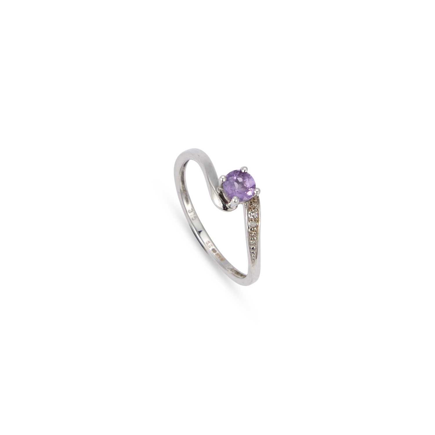 Lot 903 - A 9 CARAT WHITE GOLD AMETHYST AND DIAMOND CROSSOVER RING