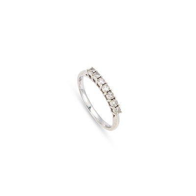 Lot 441 - A 9 CARAT WHITE GOLD HALF HOOP DIAMOND RING