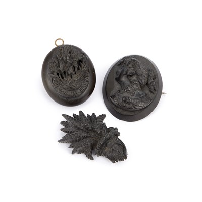 Lot 994 - A VICTORIAN VULCANITE LOCKET AND TWO VULCANITE BROOCHES