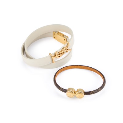 Lot 826 - A LOUIS VUITTON HISTORIC BRACELET AND AN YVES SAINT LAURENT CASSANDRE DOUBLE WRAP BRACELET