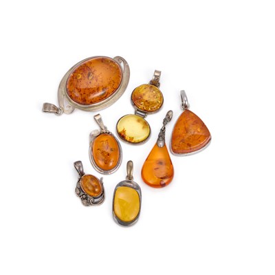 Lot 936 - A GROUP OF AMBER PENDANTS