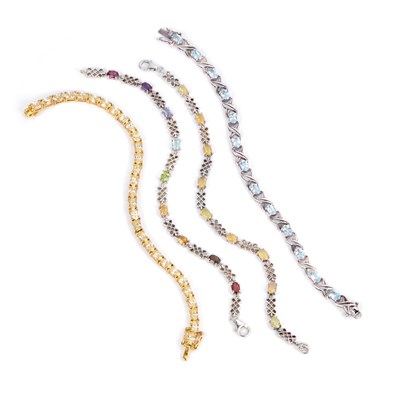 Lot 952 - FOUR GEM-SET BRACELETS