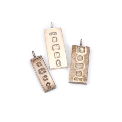 Lot 890 - THREE HALLMARKED SILVER INGOT PENDANTS