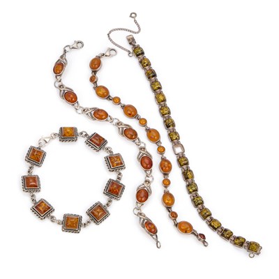 Lot 879 - FOUR AMBER BRACELETS
