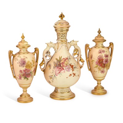 Lot 127 - A GROUP OF THREE ROYAL WORCESTER BLUSH IVORY VASES AND COVERS