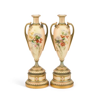 Lot 133 - A PAIR OF ROYAL WORCESTER BLUSH IVORY TWO-HANDLED VASES