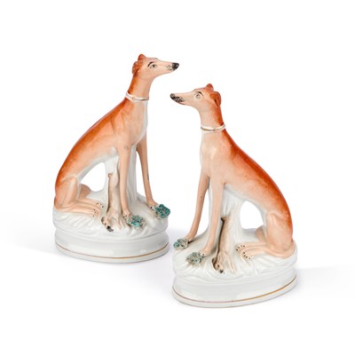 Lot 102 - A PAIR OF VICTORIAN STAFFORDSHIRE POTTERY MODELS OF GREYHOUNDS