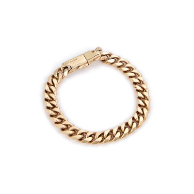 Lot 947 - A 9 CARAT GOLD FLATTENED CURB LINK BRACELET, SIGNED CARTIER