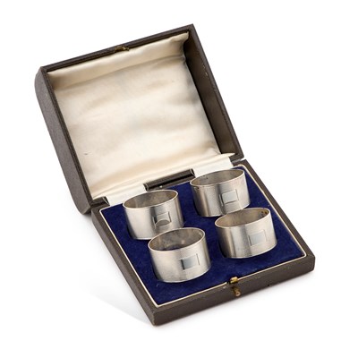 Lot 682 - A SET OF FOUR GEORGE VI SILVER NAPKIN RINGS