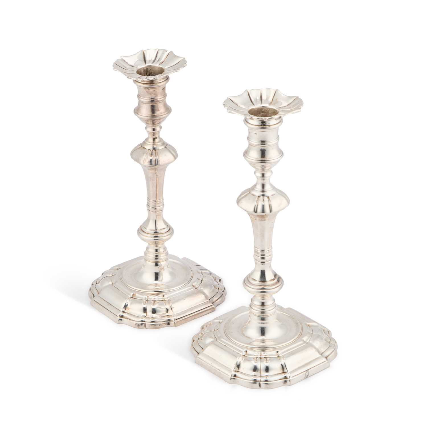 Lot 787 - A PAIR OF GEORGE II CAST SILVER CANDLESTICKS
