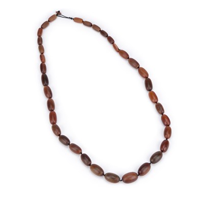 Lot 248 - A STRING OF RHINO HORN GRADUATED BEADS