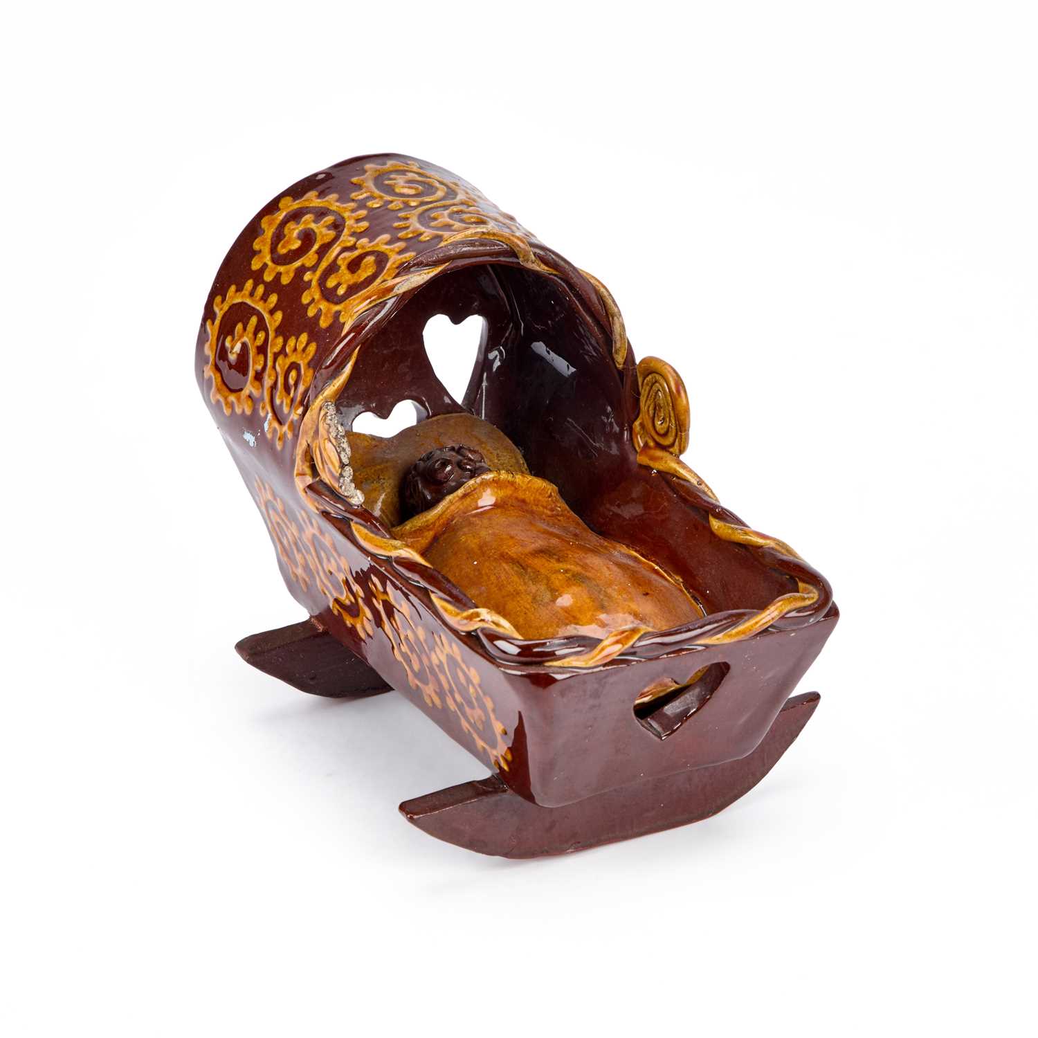 Lot 104 - A SLIPWARE CRADLE