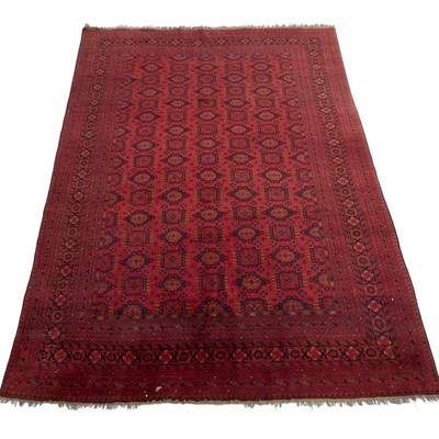 Lot 669 - AN AFGHAN CARPET