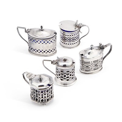 Lot 254 - A GROUP OF FIVE PIERCED SILVER MUSTARD POTS