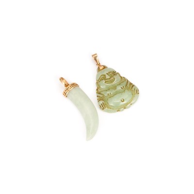 Lot 556 - TWO CARVED JADE PENDANTS