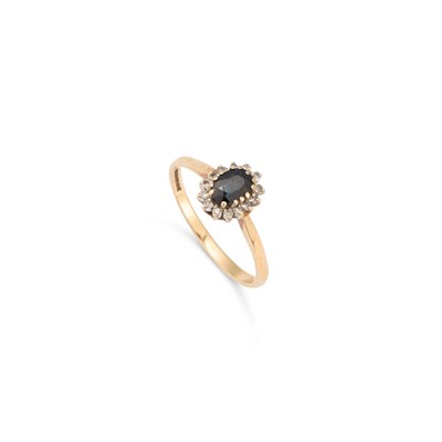 Lot 536 - A 9 CARAT GOLD SAPPHIRE AND DIAMOND CLUSTER RING