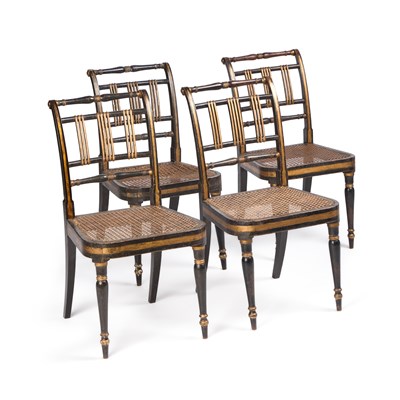 Lot 848 - A SET OF FOUR REGENCY EBONISED AND PARCEL-GILT CANE-SEATED SIDE CHAIRS