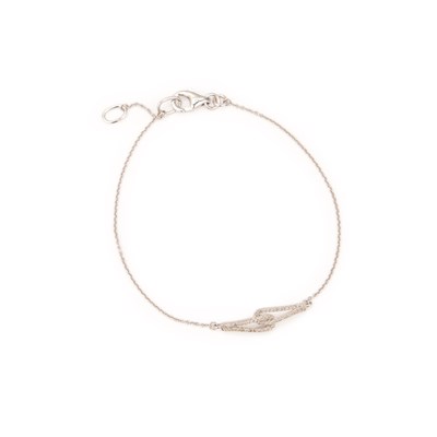 Lot 546 - A 9 CARAT WHITE GOLD DIAMOND BRACELET