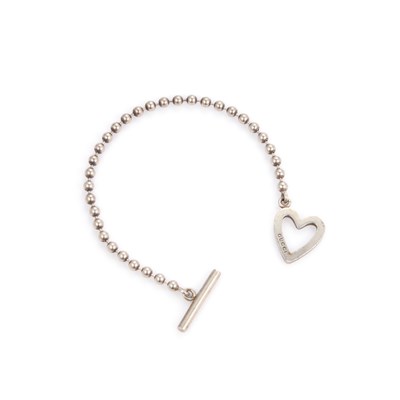 Lot 520 - GUCCI, A SILVER HEART BRACELET