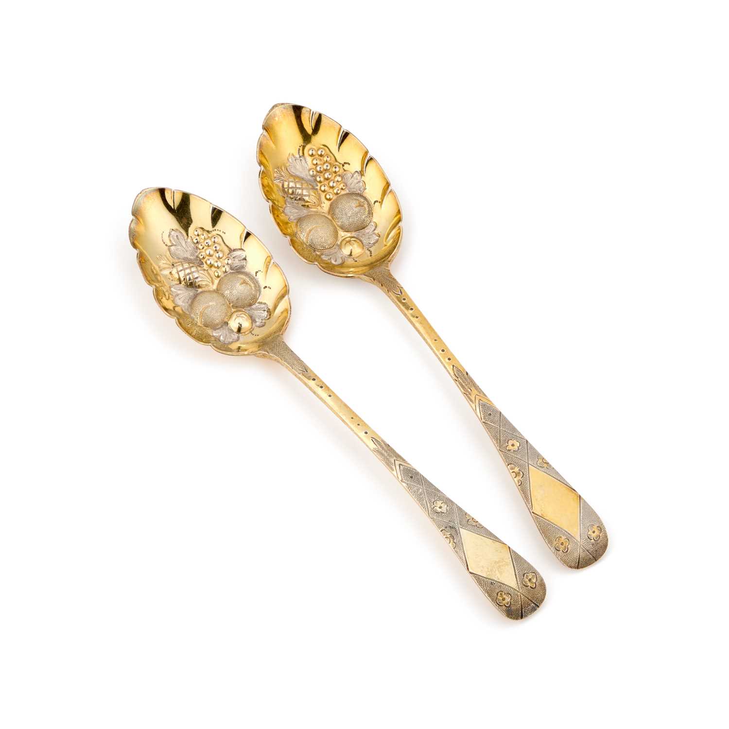 Lot 295 - A PAIR OF EDWARDIAN SILVER-GILT BERRY SPOONS