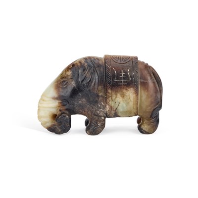 Lot 144 - A CHINESE RUSSET AND CELADON JADE CARVING OF AN ELEPHANT