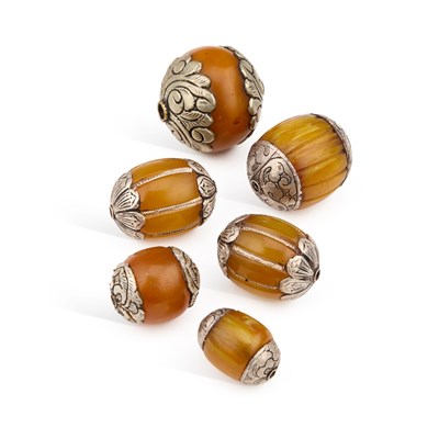 Lot 459 - A GROUP OF SIX TIBETAN AMBER BEADS