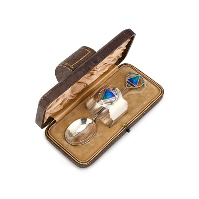 Lot 293 - AN ARTS AND CRAFTS SILVER AND ENAMEL CHRISTENING SET