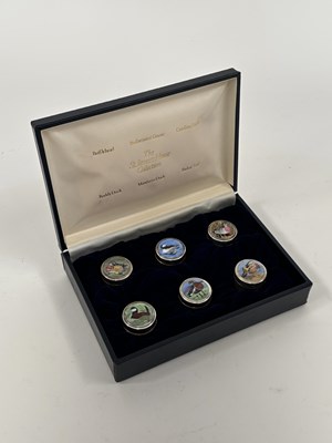 Lot 304 - A SET OF SIX ELIZABETH II SILVER AND ENAMEL LIMITED EDITION PILL BOXES