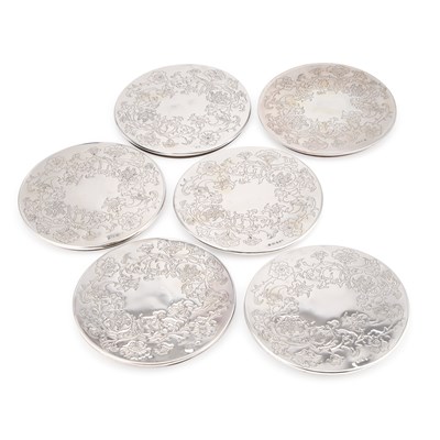 Lot 270 - A SET OF SIX ELIZABETH II SILVER-MOUNTED COASTERS