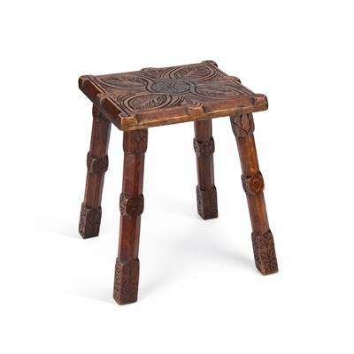 Lot 528 - AN ARTS AND CRAFTS FOLK ART CARVED OAK STOOL