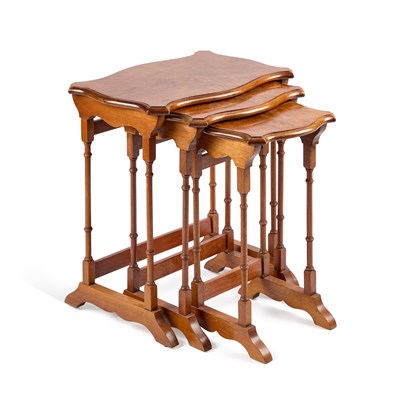 Lot 675 - A SET OF THREE BURR WALNUT VENEERED NESTING TABLES