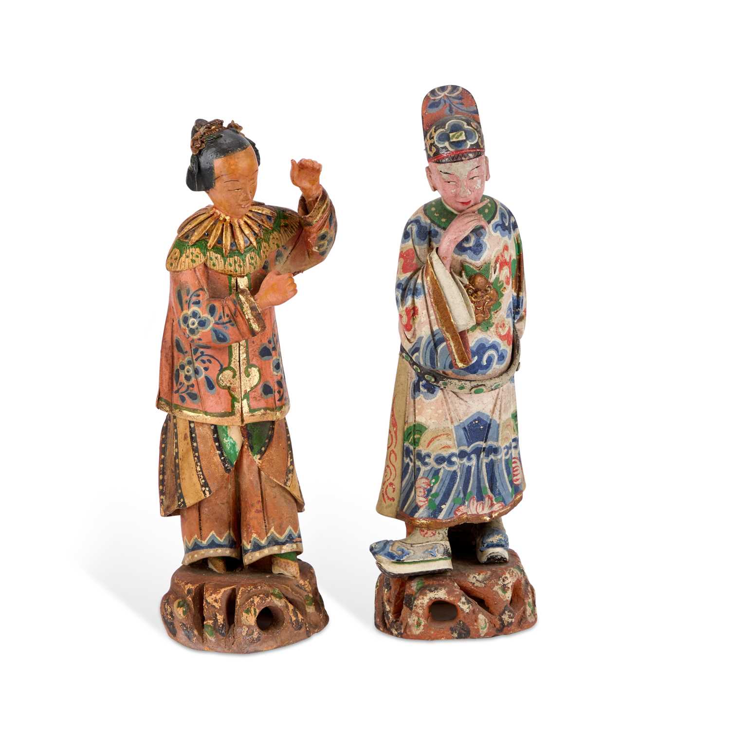 Lot 67 - A PAIR OF CHINESE POLYCHROME-DECORATED TERRACOTTA FIGURES
